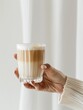 © Make Stories Studio - Female hand holding coffee. Light and airy summer photography for social media faceless digital content marketing