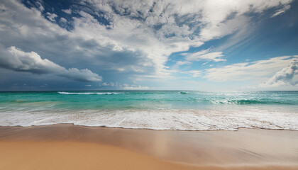 Wall Mural - Photo beautiful beach photo as a background, summer scenery view of dramatic sky, blue water and sand at tropical coast; nature concept; high quality photography