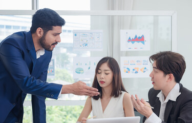 Wall Mural - Portrait business team woman and man Asian group team work meeting sitting on desk looking talk hand holding laptop notebook serious have problem consider working for new project inside home office.