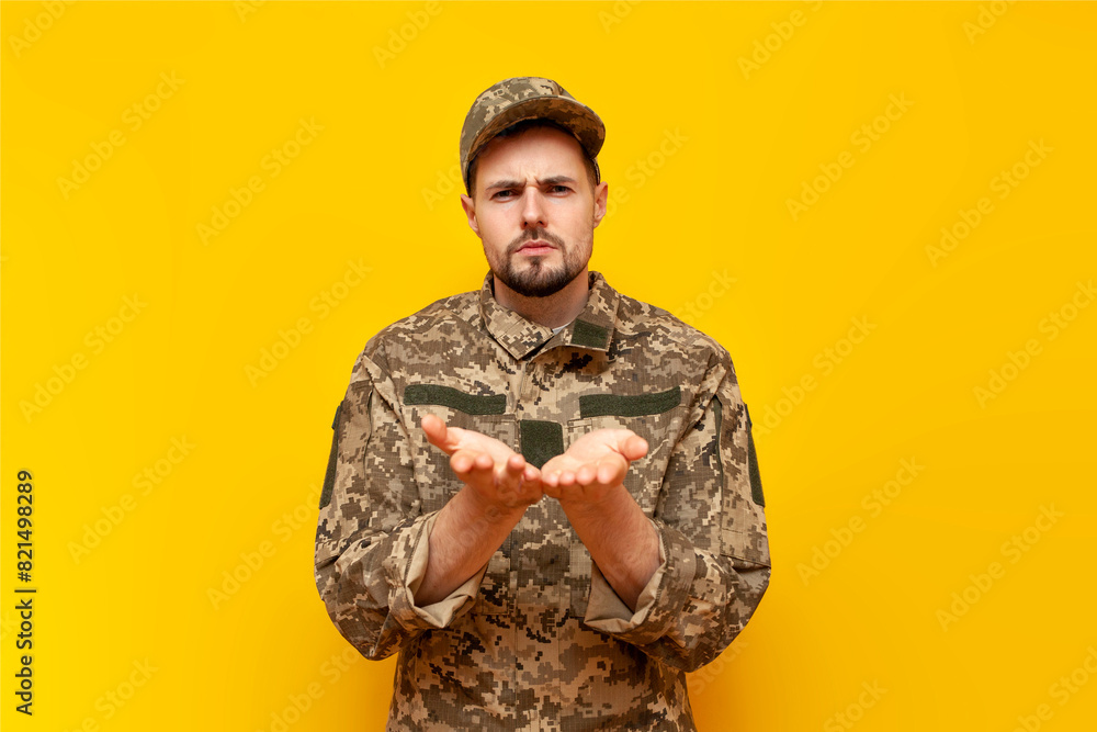 young Ukrainian army soldier in camouflage pixel uniform poking and ...