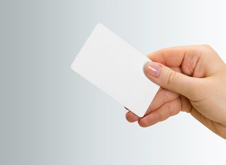 Canvas Print - human hand holds a plastic blank bank card