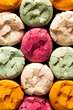 © The Picture Pantry - Closeup of multi coloured cracked macarons