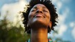 © furyon - young black woman with tears of joy looking heavenward touched by gods grace inspirational