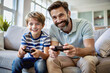 © Tatiana Sidorova - Father and son playing video game together. Father's Day concept