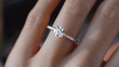 © Daniel - Close up of an elegant engagement diamond ring on woman finger. love and wedding concept. Diamond ring on young lady's hand on dark background. AI