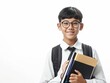 © VISUAL BACKGROUND - Asian boy in school uniform holding books and smiling.
