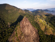 © Cavan - Beautiful sunrise aerial view to rocky peak and green rainforest