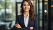 © Neha - Young businesswoman standing confidently at office