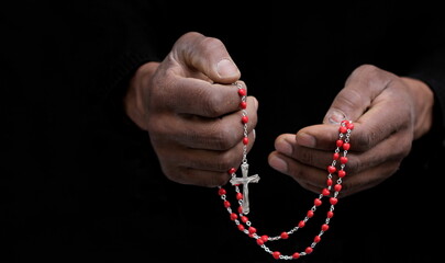 Poster - praying to God with hands together with  on black background with people stock image stock photo	