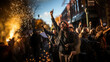 © AS Photo Family - The image captures the atmosphere of a protest with people raising their hands, sparkling flares, and twilight sky
