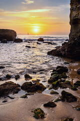 Wall Mural - Sunrise at the rocky coastline of Praia dos Estudantes Beach, Lagos, Algarve, Portugal	