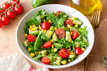 Wall Mural - Salad with avocado, tomatoes and corn. Healthy eating. Vegetarian food.