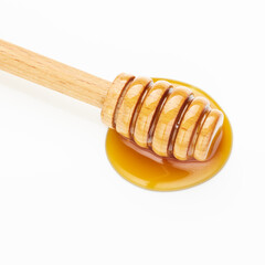 Canvas Print - honey wooden dipper isolated on white background