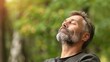 © Wanlop - Bearded Man Enjoying The Peace And Quiet Of Nature With His Eyes Closed.