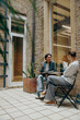 © Daria - Two female colleagues have a coffee break time while sitting on office terrace