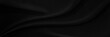 © Kamjana - Black gray satin dark fabric texture luxurious shiny that is abstract silk cloth background with patterns soft waves blur beautiful.