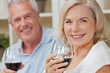 © Darren Baker - Happy Senior Man and Woman Couple Drinking Wine at Home
