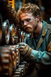 © yuliachupina - Technician inspecting gears in giant industrial machine