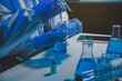 © ARMMY PICCA - chemist,scientist hand dropping chemical liquid into test tube, science research and development concept