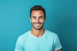 © Zickert - Cyan background Happy european white man realistic person portrait of young beautiful Smiling man good mood Isolated on Background Banner with copyspace