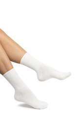 Female feet wearing white cotton socks on white background