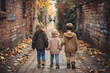 © Dennis - Three children seen from behind walking down a road during the day, siblings concept