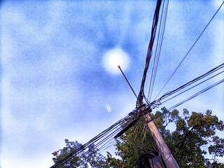 Wall Mural - Old pole with wires against the sky. Electric transmission line. Eco-friendly energy