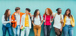 © Davide Angelini - Diverse young people standing together in front of blue wall - Photo portrait of teenagers laughing together - Banner and 16:9 people background