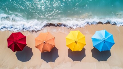 Wall Mural - Colorful Beach Umbrellas Overlooking Turquoise Sea on Sandy Shoreline