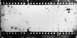 © Nice Seven - A blank white film strip with grunge texture on the edges on white background. vintage grunge film ,  dirty gritty analog vignette border, scratched and streaked negative strip