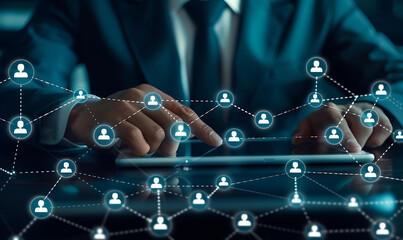 Aufkleber - A businessman using a digital tablet to manage customer relationships, featuring a virtual network overlay of interconnected icons, representing CRM and global communication