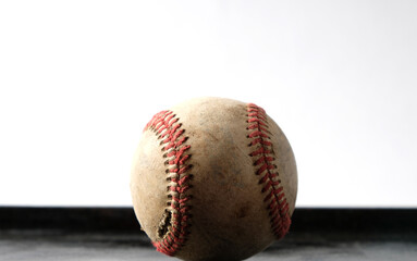 Wall Mural - Old baseball ball close up with white background for sport.