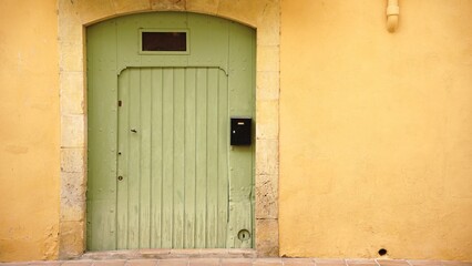 Wall Mural - traditional access door to the building on the facade