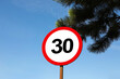 © New Africa - Road sign Maximum speed limit against blue sky