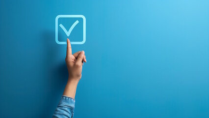 Woman's hand pointing at checkbox isolated light blue background.