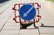 © Станислав Вершинин - A plastic barrier with a road sign warns of a sewer failure and the need to bypass