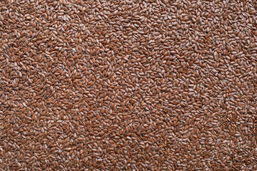 Organic linseed or flaxseed texture or surface as background.