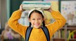 © peopleimages.com - Child, face and books on head or excited for school learning or reading lesson, classroom or education. Girl, kid and portrait as youth student for academic development or knowledge, study or happy