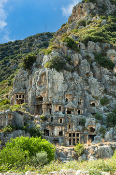 Myra archaeological site with rock tombs in Demre, Turkey. The Ancient City of Myra is especially famous for its Lycian-Era rock tombs, Roman-Era theatre