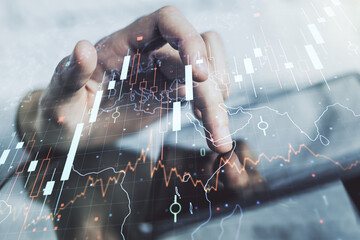 Double exposure of abstract creative financial diagram with world map and with finger clicks on a digital tablet on background, banking and accounting concept