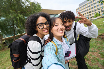 Wall Mural - selfie of three young students at the campus