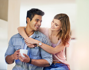 Poster - Couple, hug and love in house with coffee for relationship, date and time together in living room. Man, woman and support with happiness, tea and smile in home for connection, care and commitment