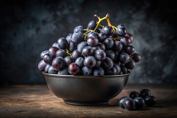 Wall Mural - Bowl of Fresh Black Grapes on a Rustic Table