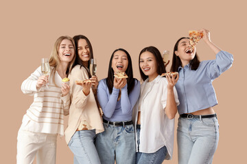 Poster - Group of young women with champagne and pizza on beige background. Hen Party