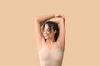 © Pixel-Shot - Beautiful young African-American woman on brown background