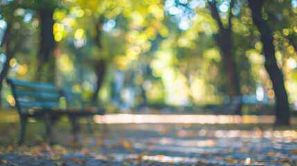 Blurred autumn park background. A blurry photo of a bench in a park with autumn colors and bokeh effect. Perfect for backgrounds and designs.