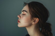 © MagnusCort - A close up of a woman's face with her eyes closed looking to a side