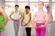 © JackF - Slim adolescent female attendee of dancing classes training ballet positions together with other group members