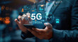 © Hound - Businessman with 5G hologram on his hand and element of this image furnished, smart city and network connect concept