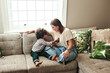 © peopleimages.com - Home, stethoscope and mother with boy, play and bonding together with happiness, smile and chilling. Apartment, family and mama with son, single parent and fun with toy, listening and creativity